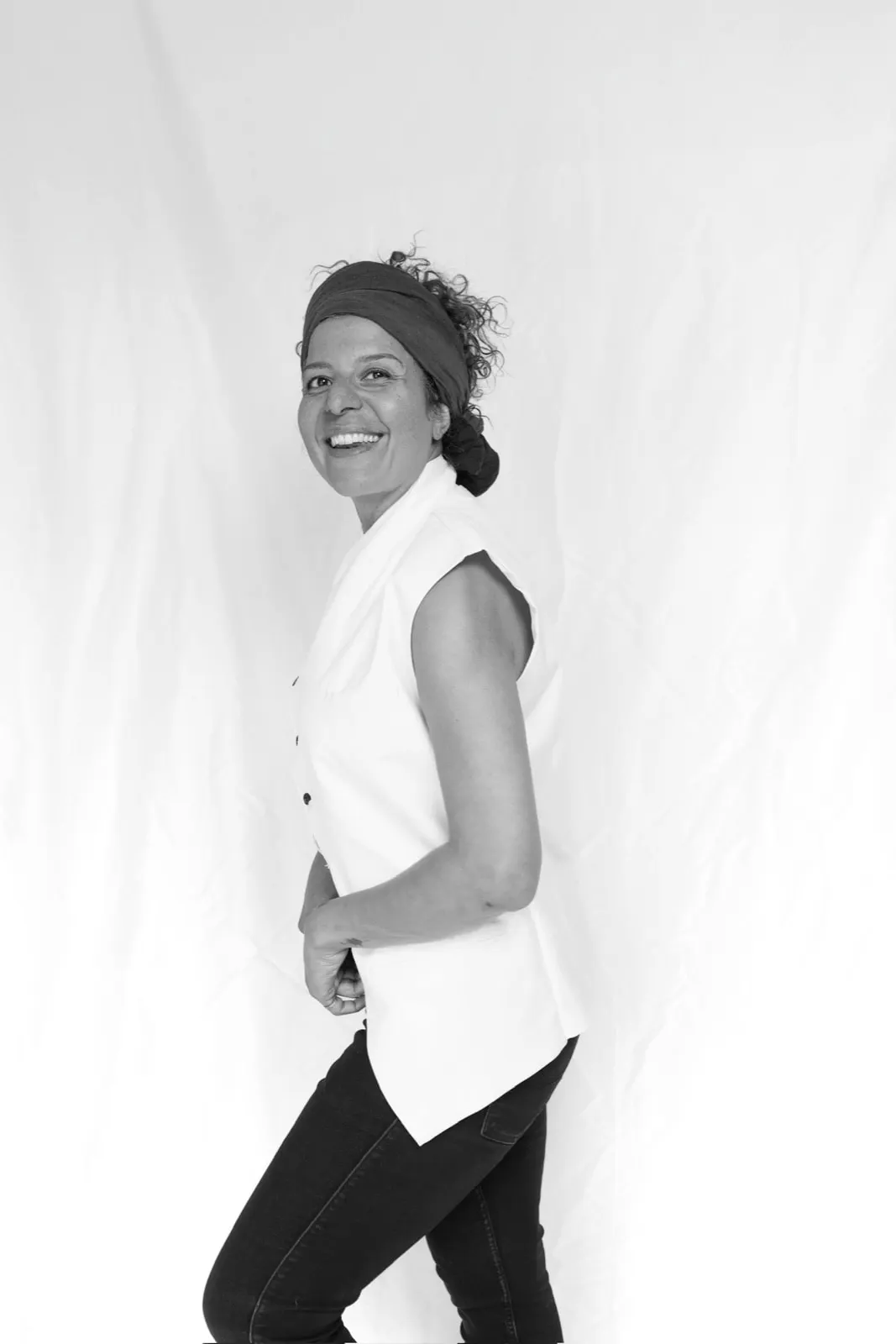 Chef Yasmina Ksikes laughing, black and white portrait